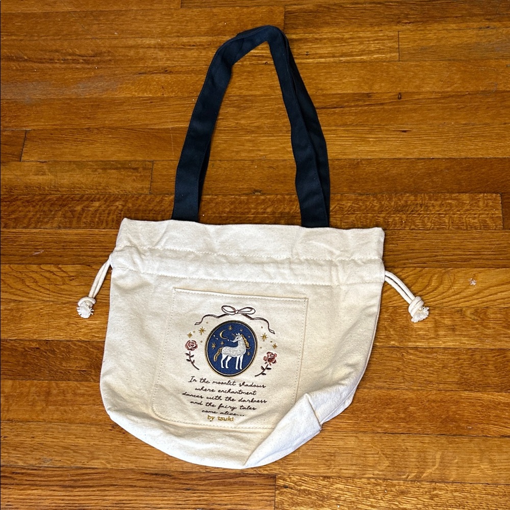 Elegant Cream Tote Bag with Black Straps